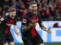Leverkusen's Robert Andrich wheels away after his late goal kept their unbeaten streak alive. (AP PHOTO)
